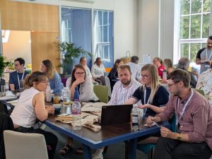 image of people coming together to discuss technology and neurodiversity services
